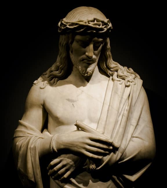A statue of Christ with his hands bound and the crown of thorns upon his head Economics informed by Catholic social teaching means we recognize the spiritual side of economic activity, trust in God, and gratuitousness without concern for personal gain.