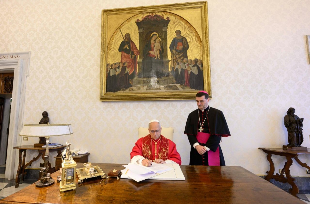 Pope Leo XIV signs his first encyclical, Magnifica Humanitas